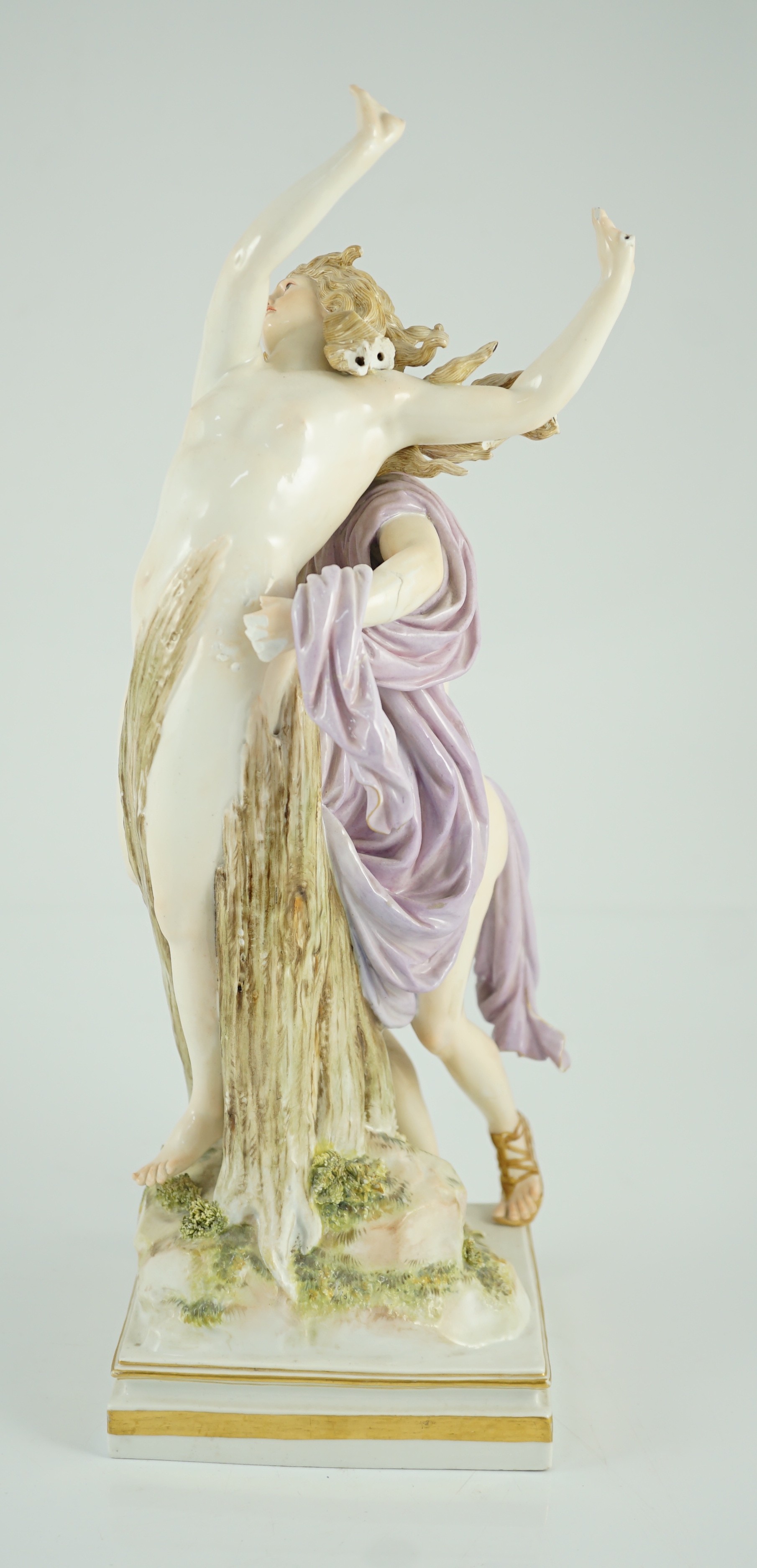 A Meissen allegorical group of Apollo and Daphne, 19th century, 36cm high, losses to hands and hair